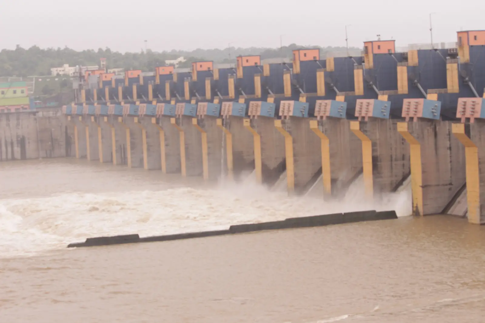 Water rushing through the open spillway gates of the Omkareshwar Dam on the Narmada