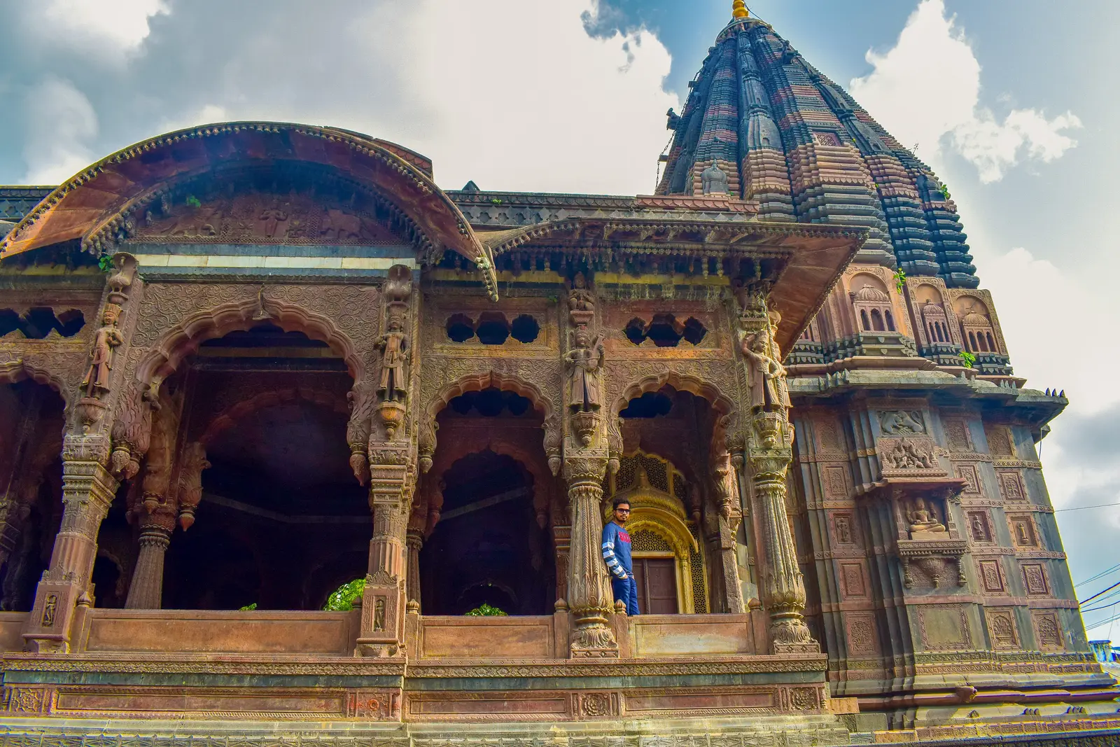 Carved stone arches and the tall spire of one of the Krishnapura Chhatris, the Holkar cenotaphs in Indore's old city