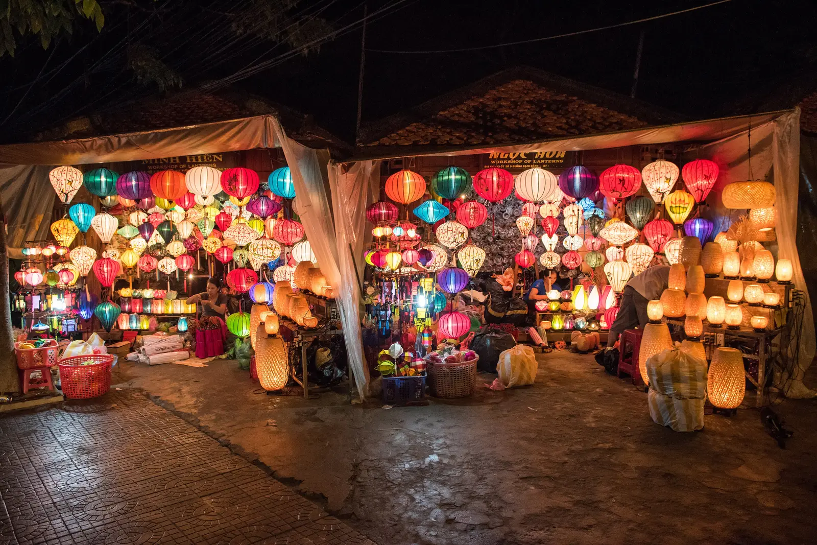 Lantern shop at night in Hoi An, central Vietnam, with rows of glowing silk lanterns in many colours